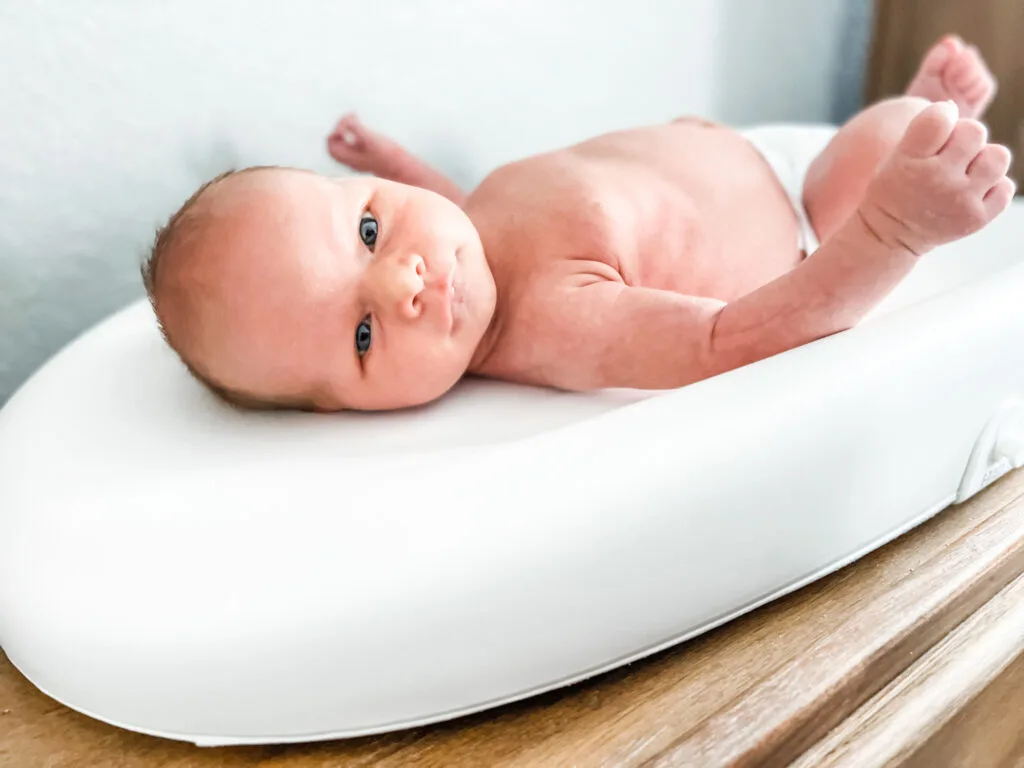 My newborn on the hatch smart changing table