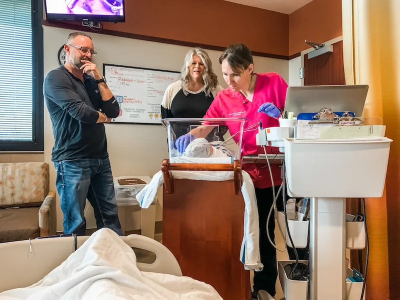 nurse checking on our baby in the hospital room