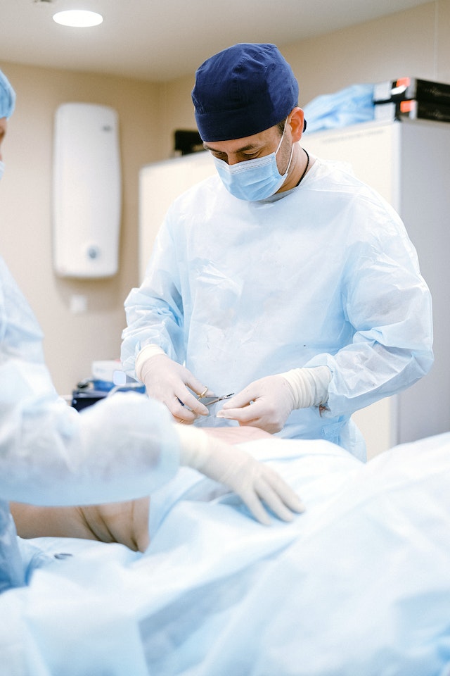 plastic surgeon performing a tummy tuck